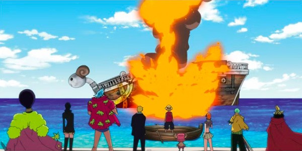 l'équipage du bateau de Luffy est en train de regarder le Vogue Merry partir en fumée sur la mer.